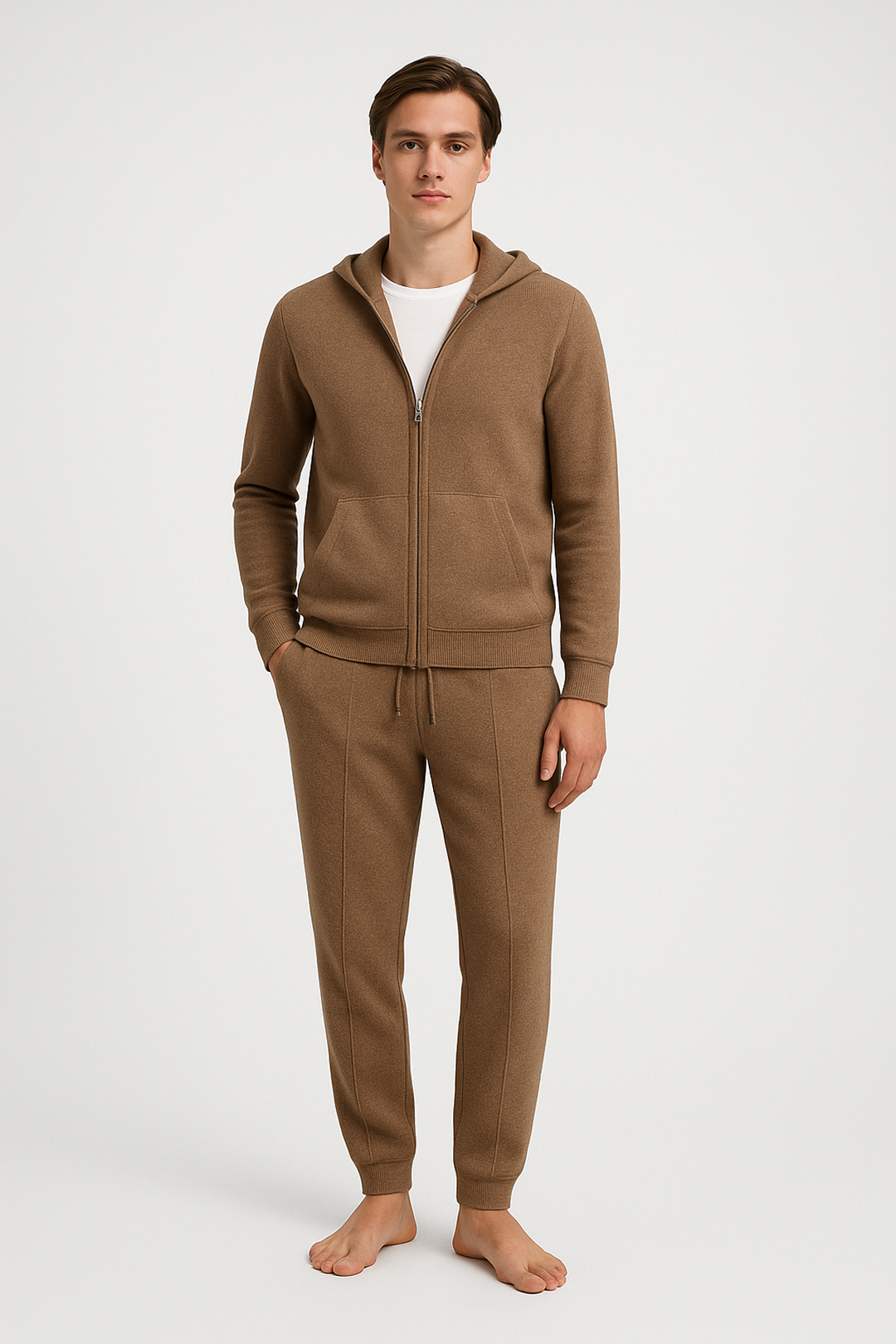 Man wearing a brown tracksuit on a white background