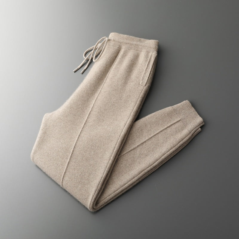 Beige sweatpants on a gray background