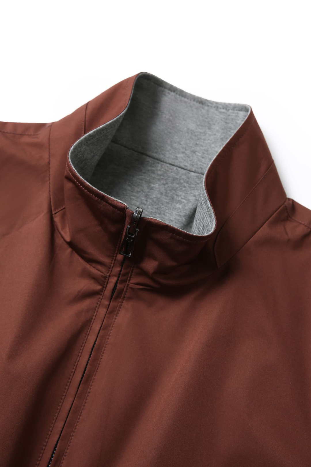 Brown jacket with gray lining on a white background