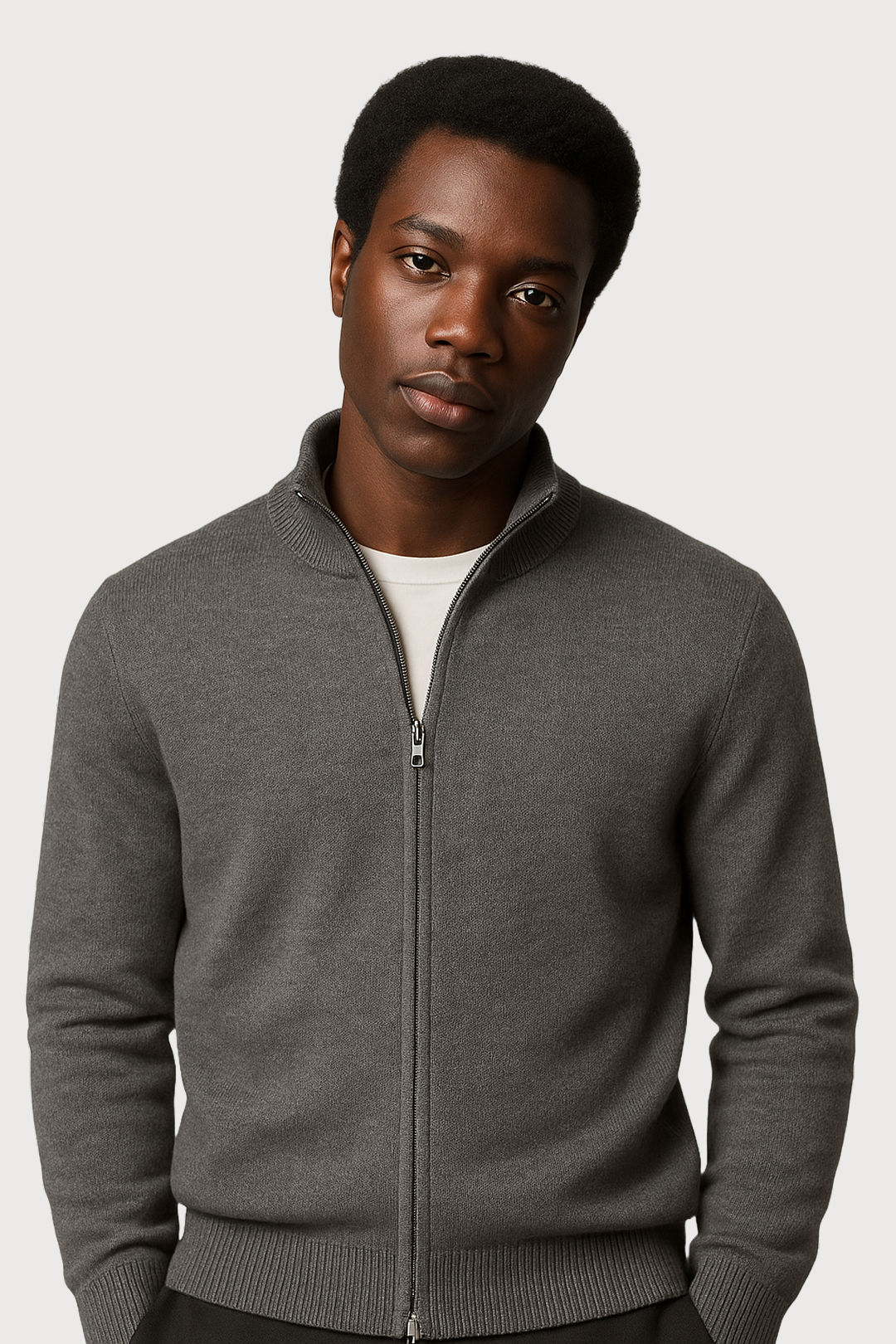 Man wearing a gray full zip-up cardigan against a white background