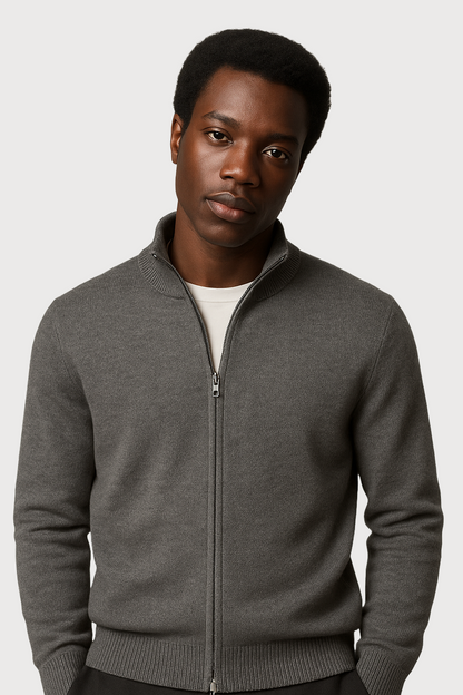 Man wearing a gray full zip-up cardigan against a white background