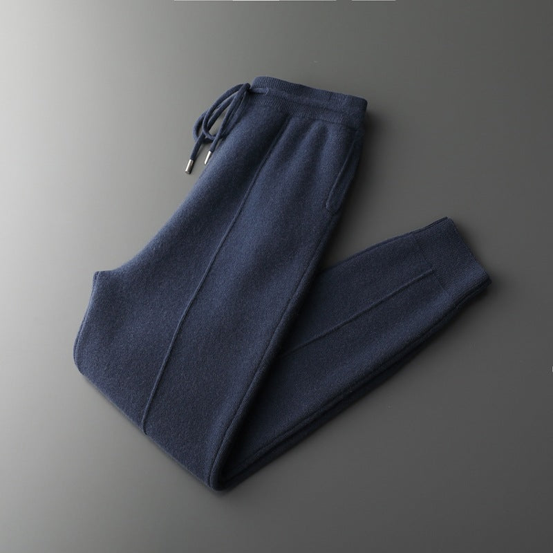 Blue pants with drawstring on a gray background