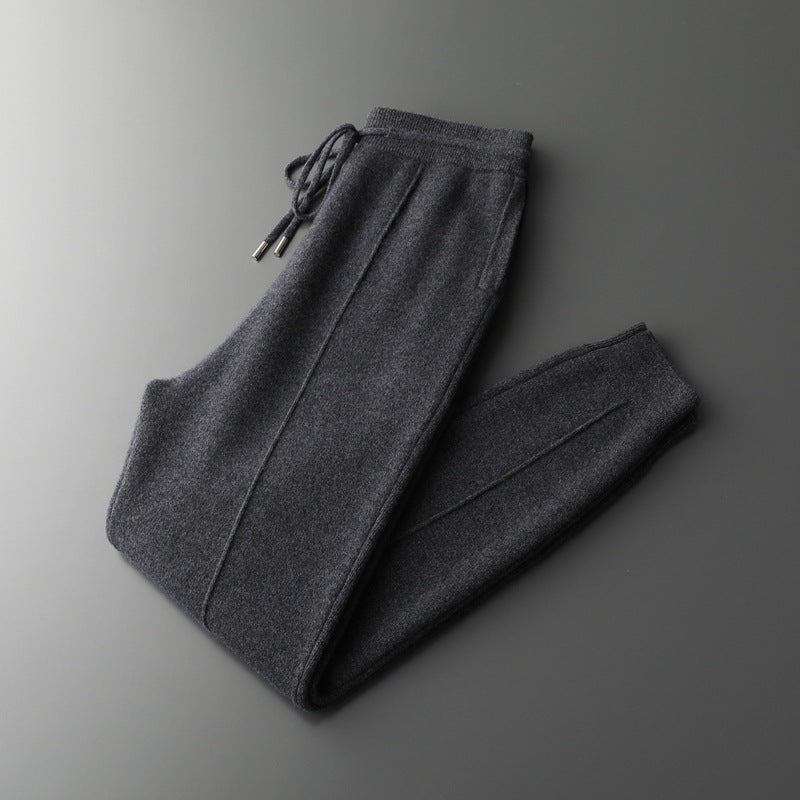 Dark gray sweatpants on a gradient gray background
