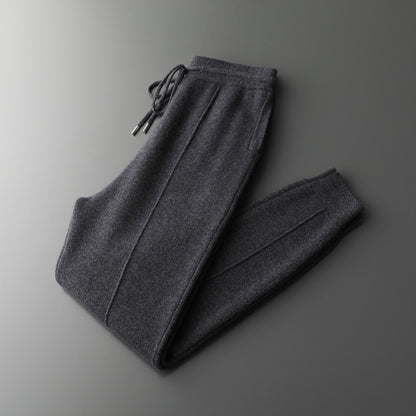 Dark gray sweatpants on a gradient gray background