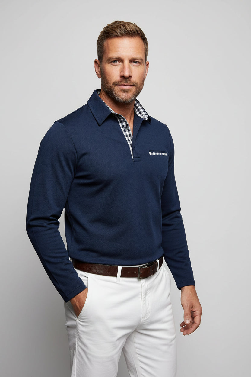 Navy long-sleeve polo shirt with plaid collar worn by a person on a white background