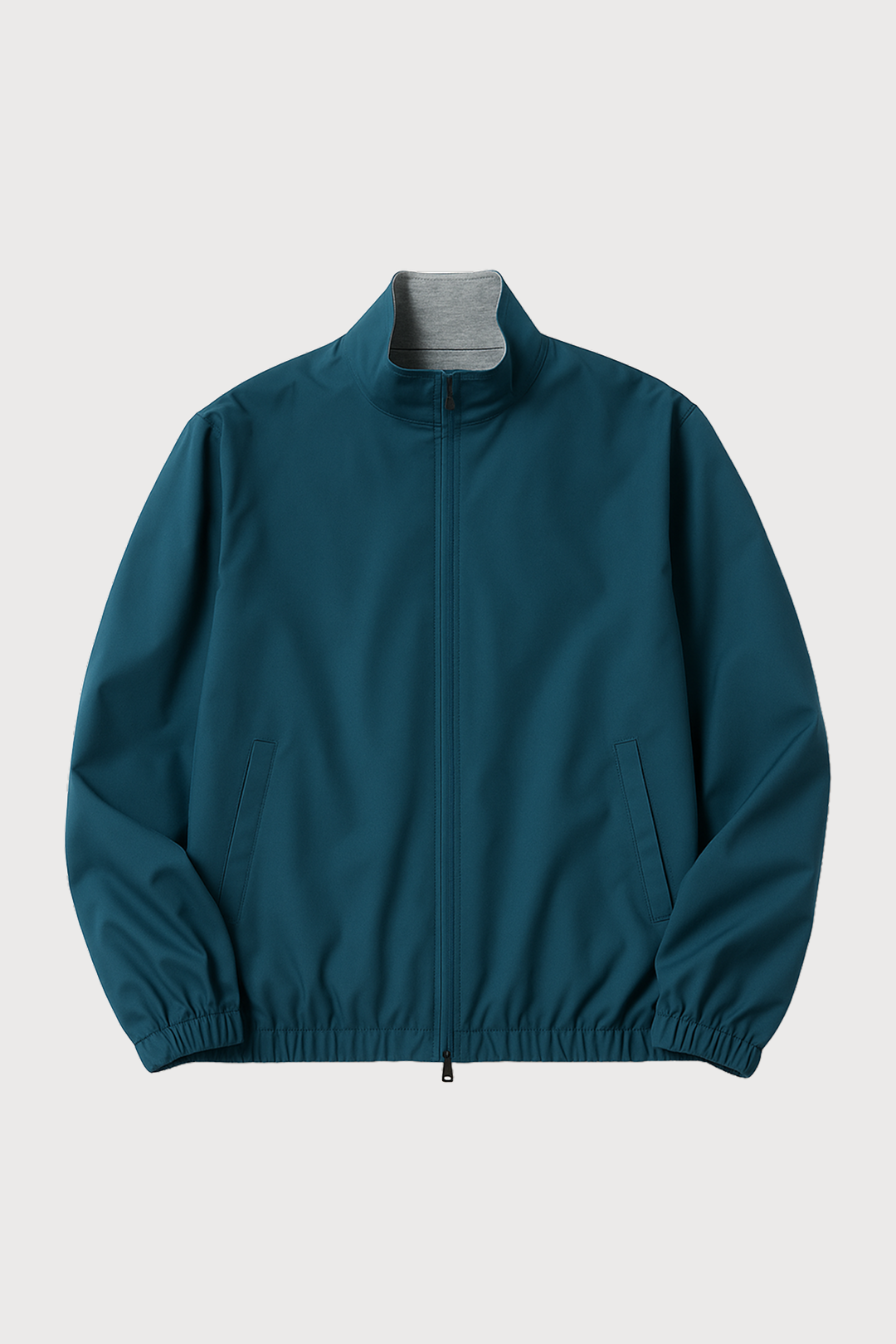 Teal jacket with a gray collar on a light gray background